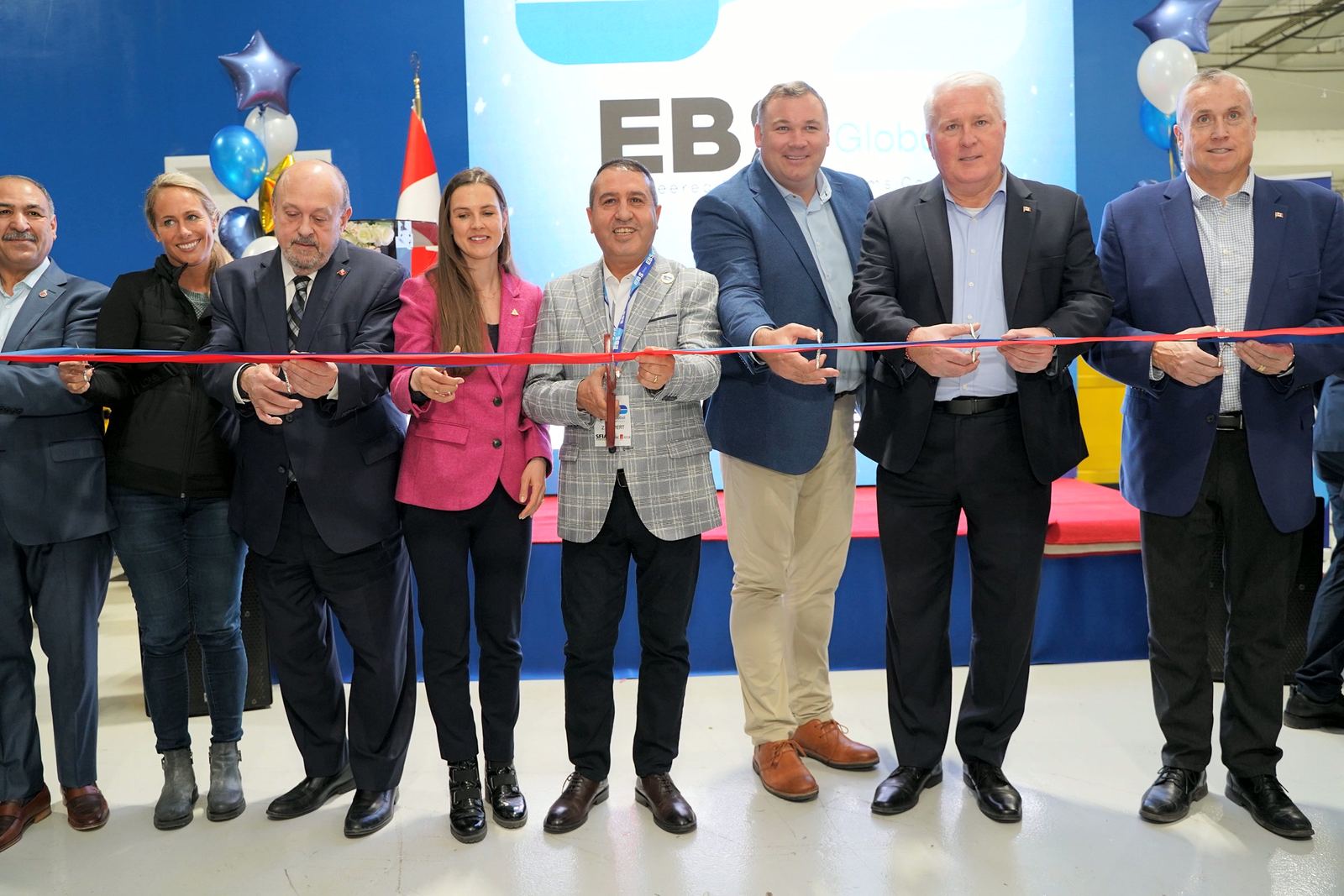 The ribbon being cut at the opening of the EBS Global facility in Barrie