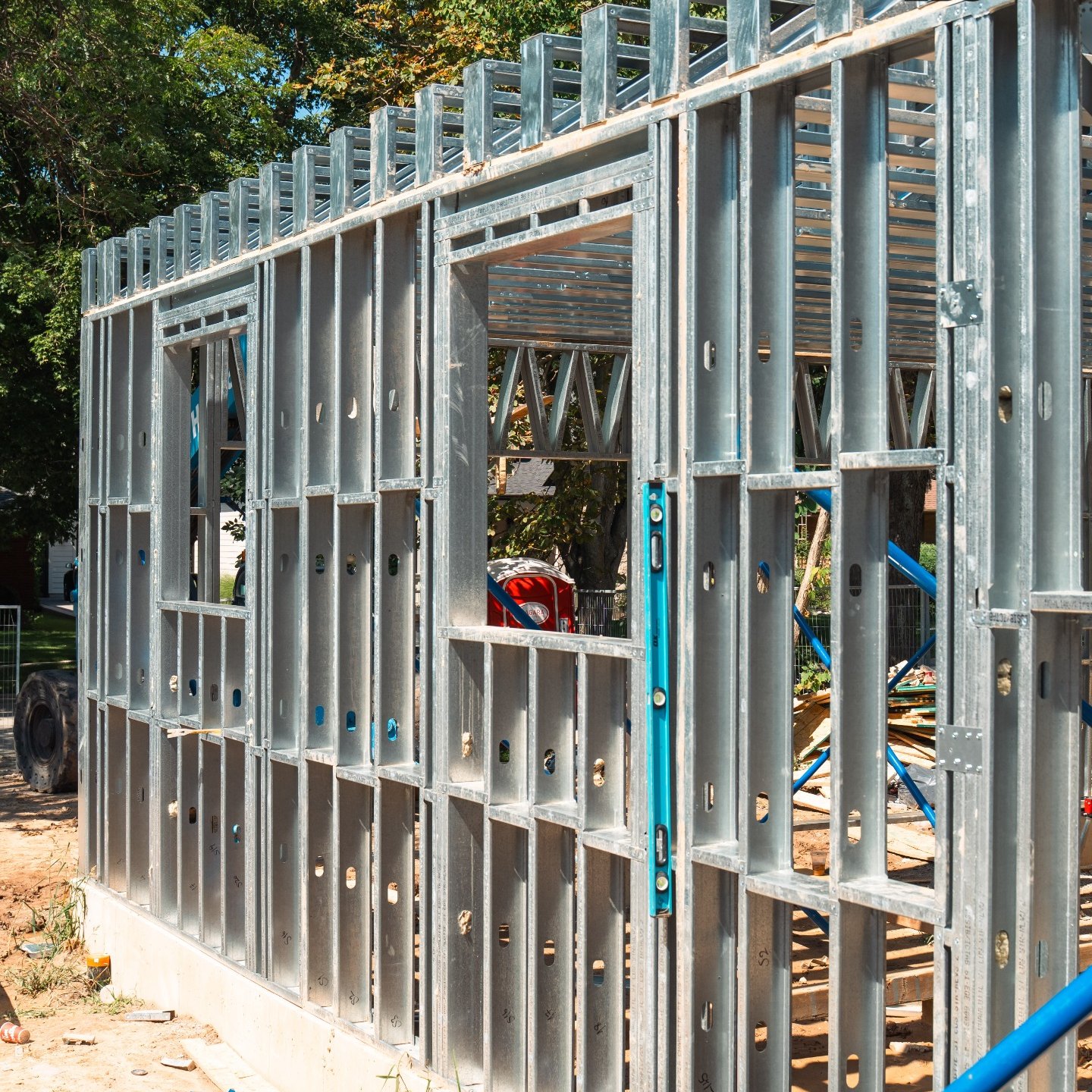 Wall panels braced and plumbed on site.