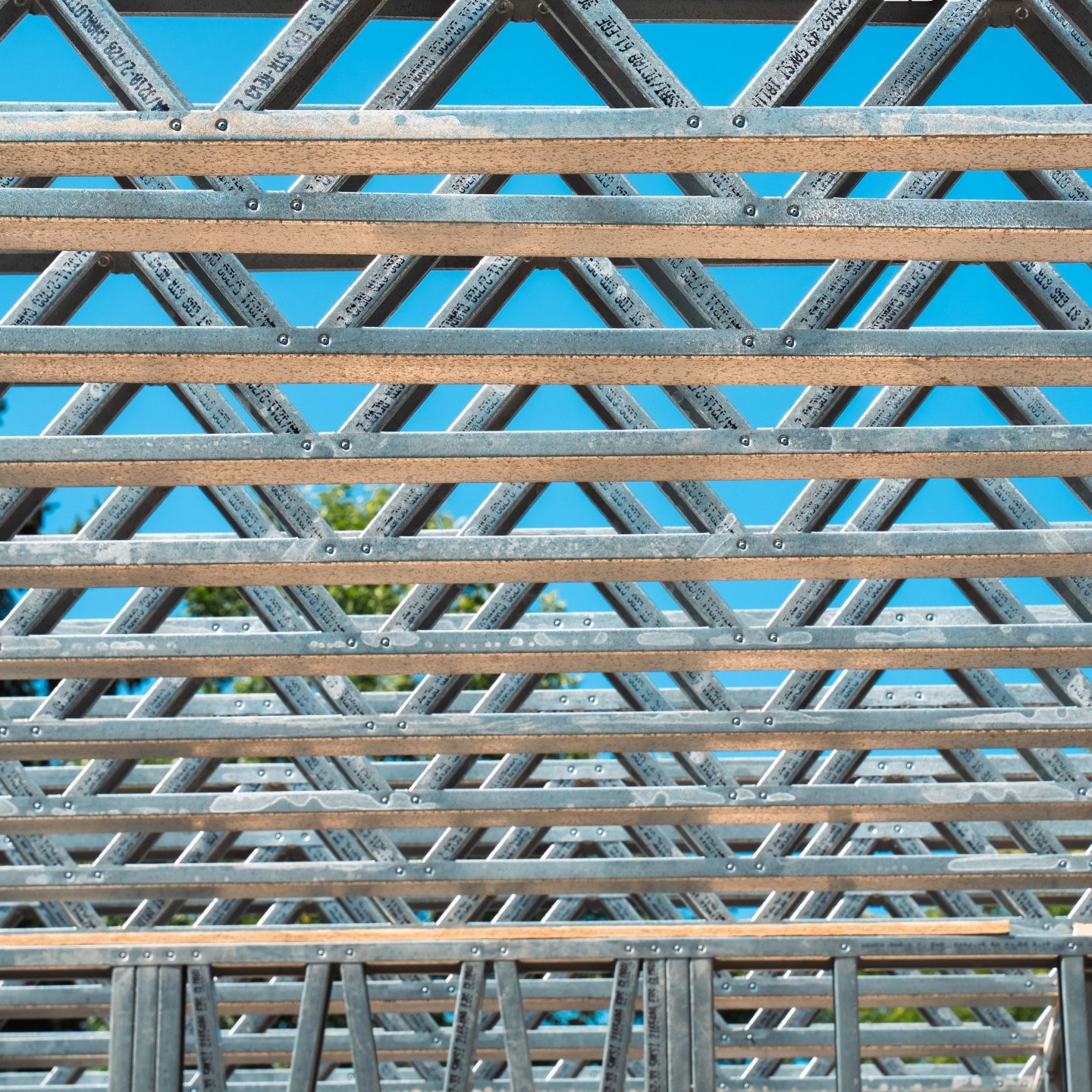 Floor trusses set on the walls below.