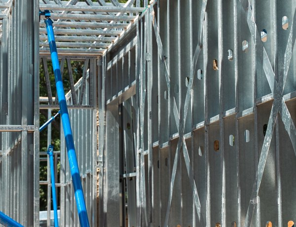 Cold-formed steel floor trusses seen from below on an EBS Global site