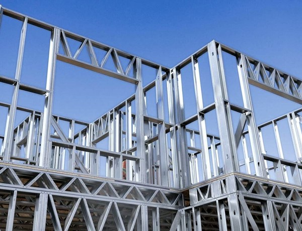 Prefabricated cold-formed steel wall panels standing against a blue sky