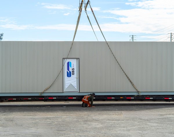 Completed modular trailer unit with an EBS Global banner, built at the Barrie plant