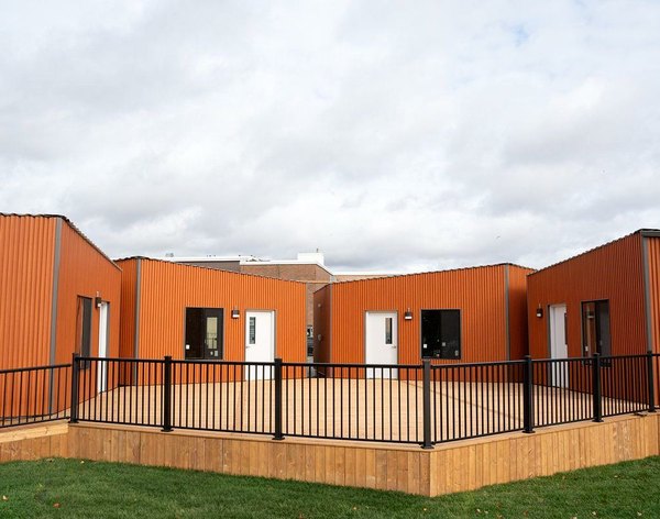 Modular classroom units clad in orange corrugated steel, Parry Sound High School
