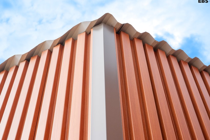 Orange ribbed steel cladding at a corner of the Parry Sound classroom modules