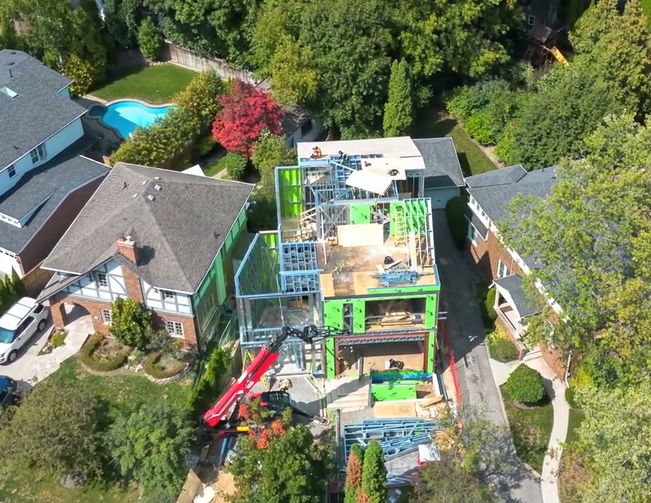 The North York project: aerial view of the two-storey cold-formed steel house with the crane on site