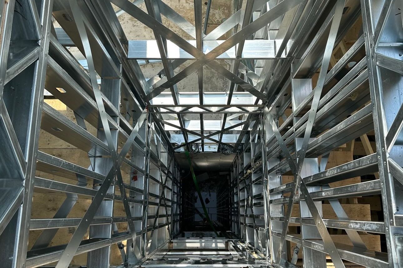 Looking down a multi-storey cold-formed steel shaft with X-bracing